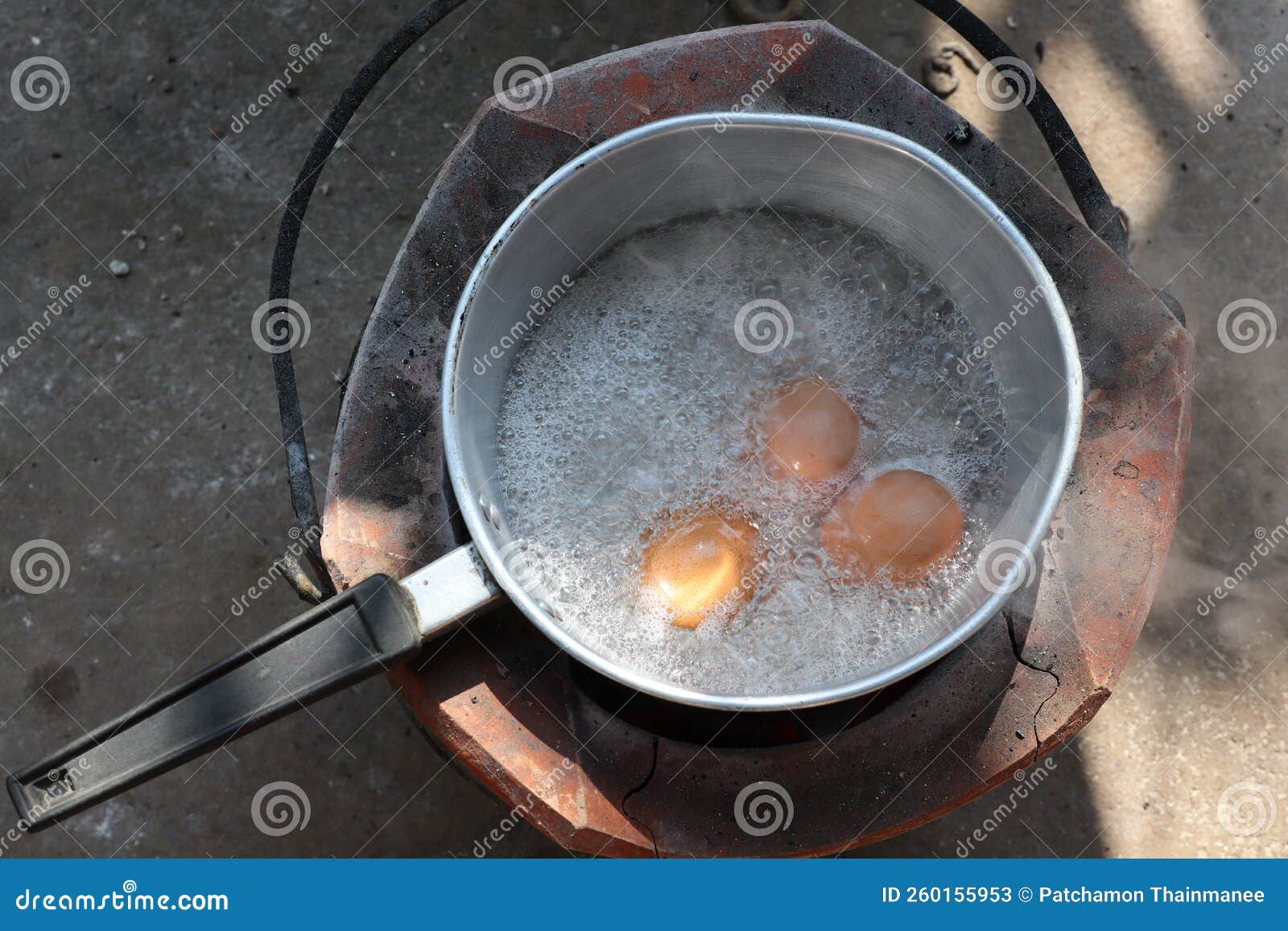 Top View of Boiled Eggs in a Pot on a Charcoal Stove Stock Image
