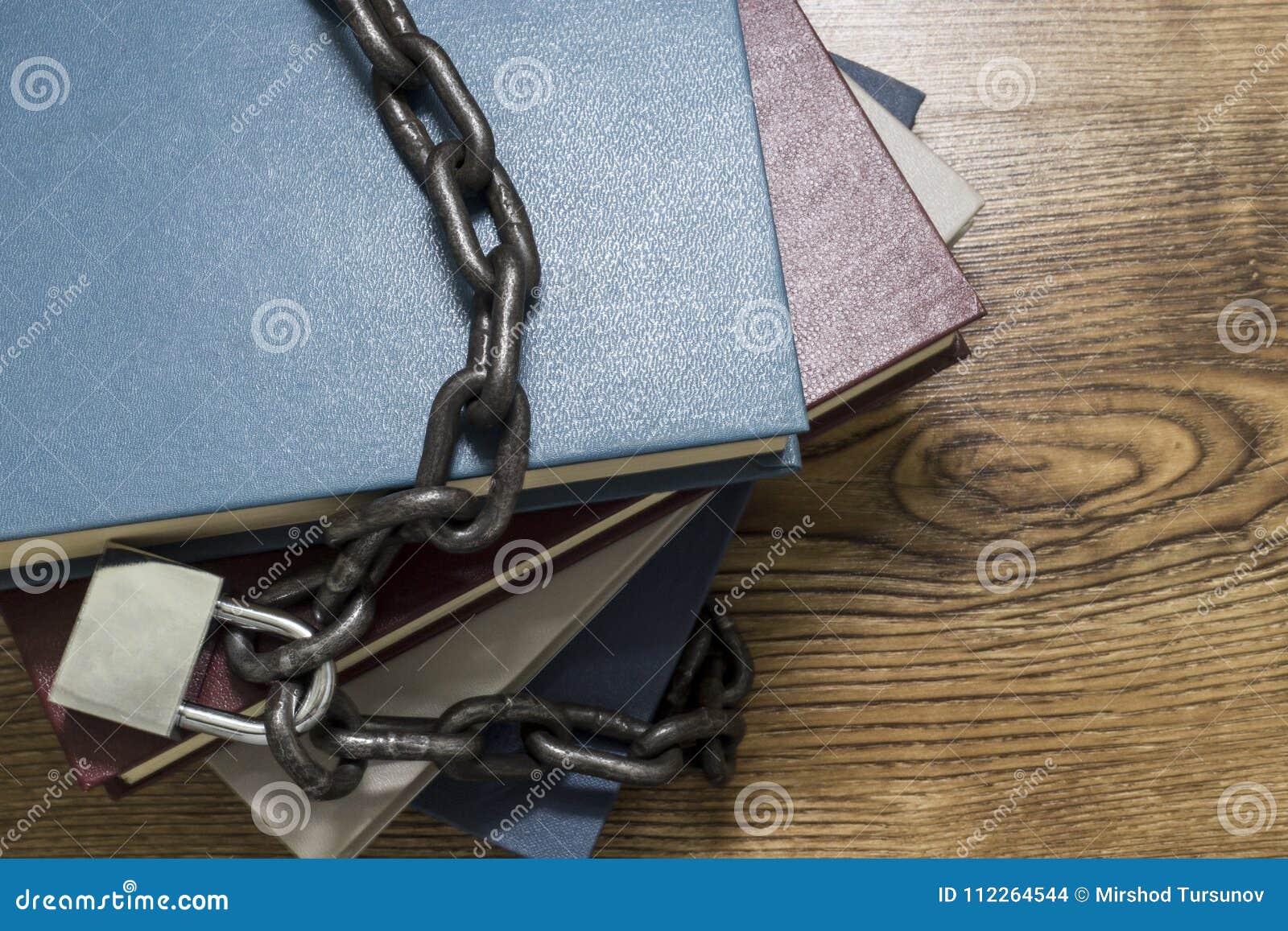 Top View of Books Locked with Padlock and Chains. Stock Photo Image