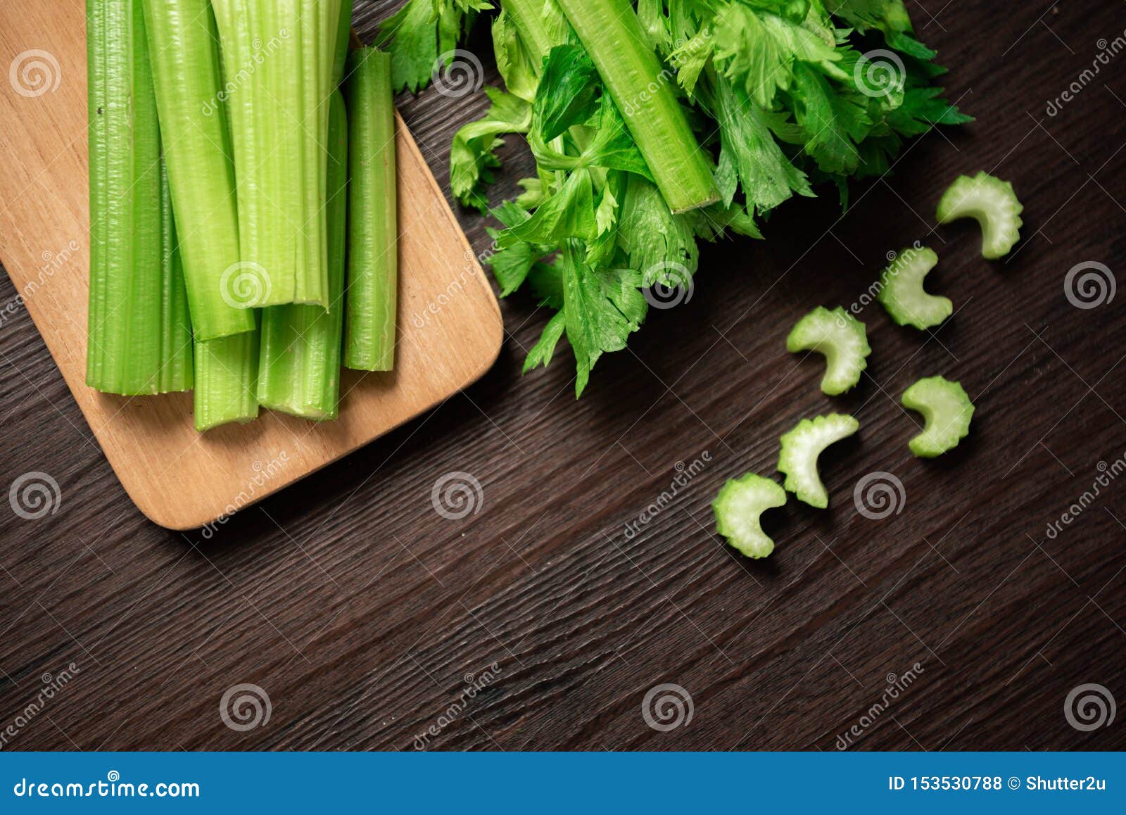 repose wooden crocodile Top View of Bunch of Fresh Sliced Celery Stalk on Wooden Table with Leaves.  Food and Ingredients of Healthy Vegetable Stock Photo - Image of  agriculture, cuisine: 153530788
