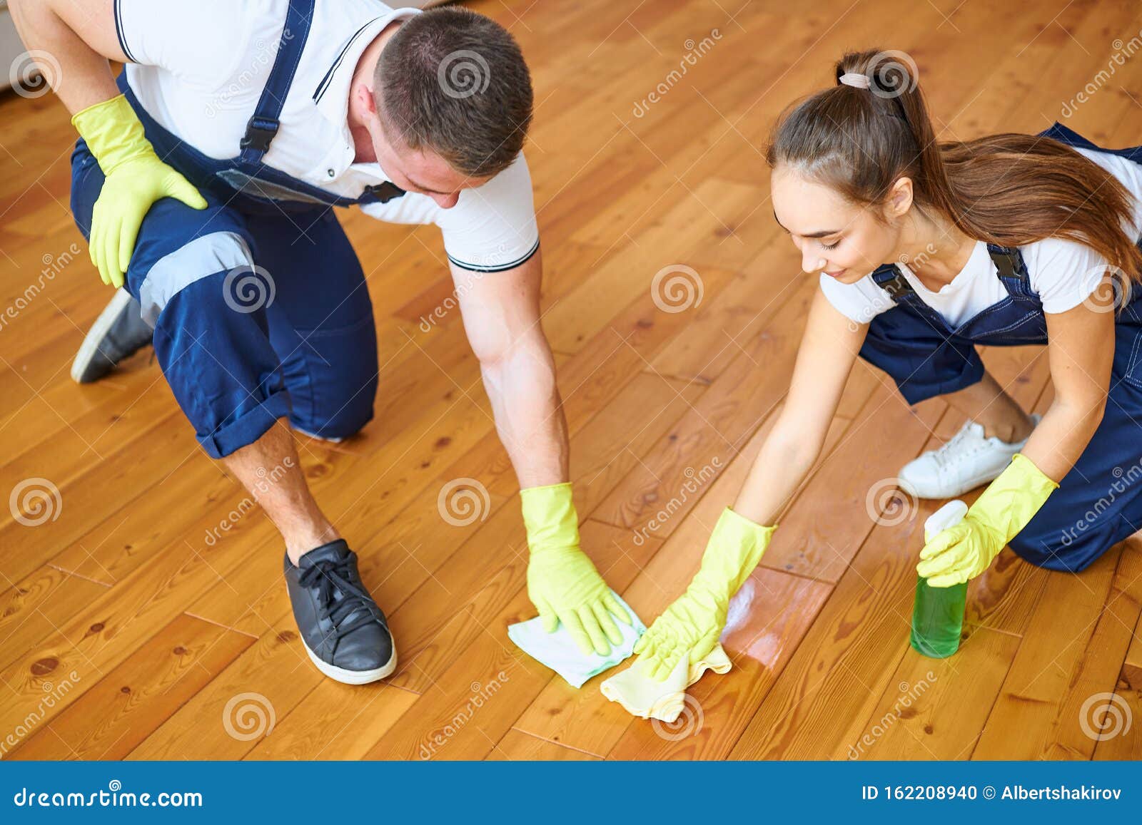 Top View On Cleaners Polishing Wooden Floor Stock Photo Image Of