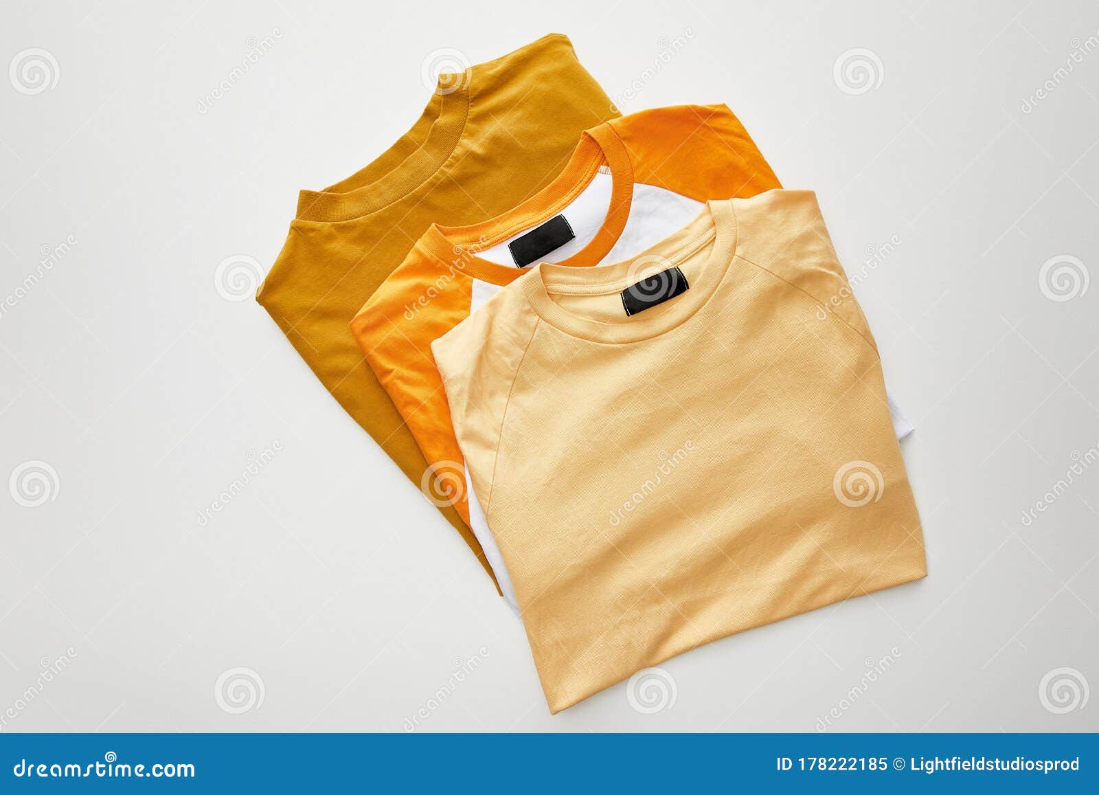 View of Color Folded T-shirts Stock Image - Image of clothes, beige ...