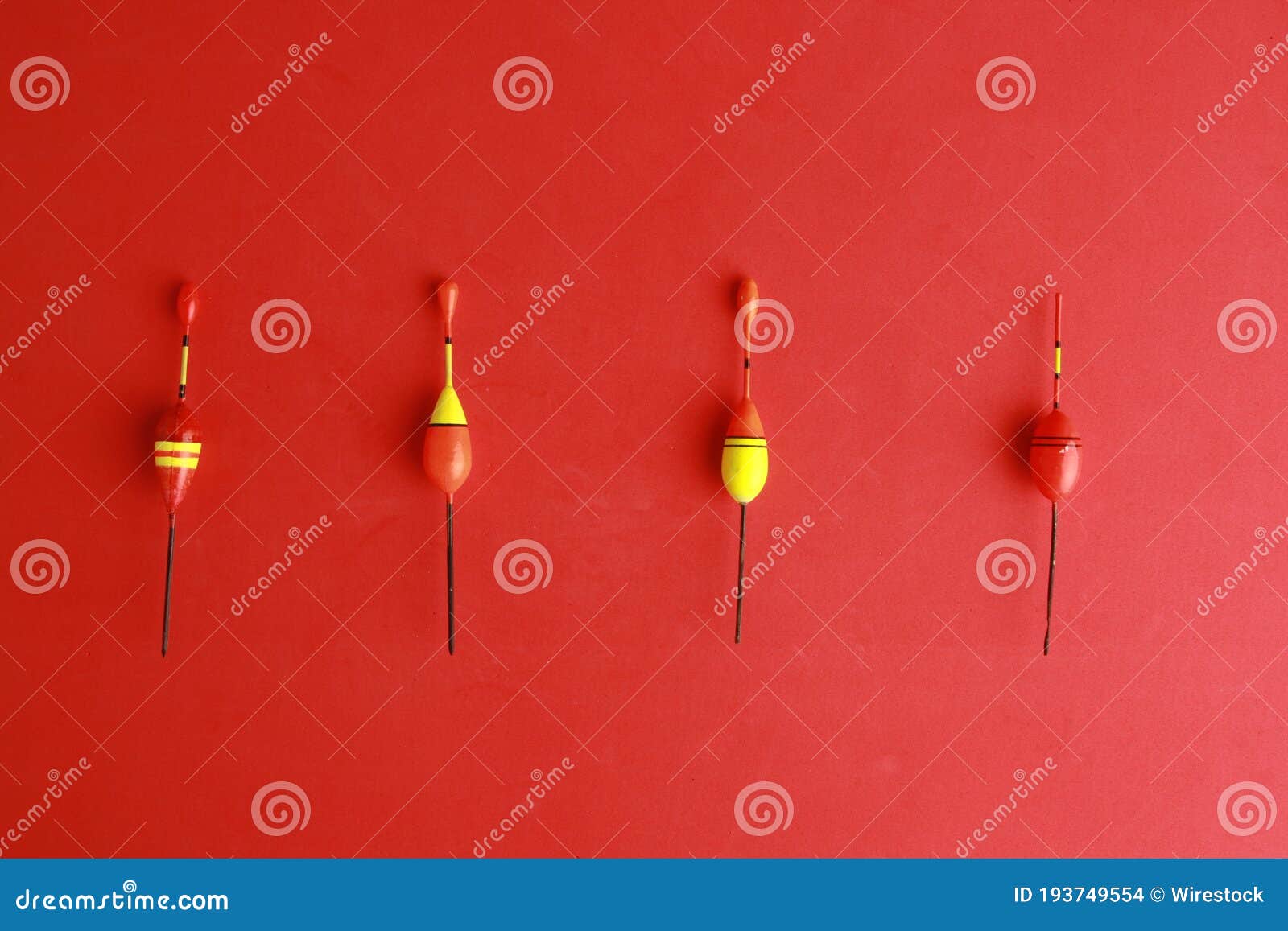 Top View of Colorful Fishing Rod Bobbers on a Red Background Stock Photo -  Image of lifestyle, tackle: 193749554