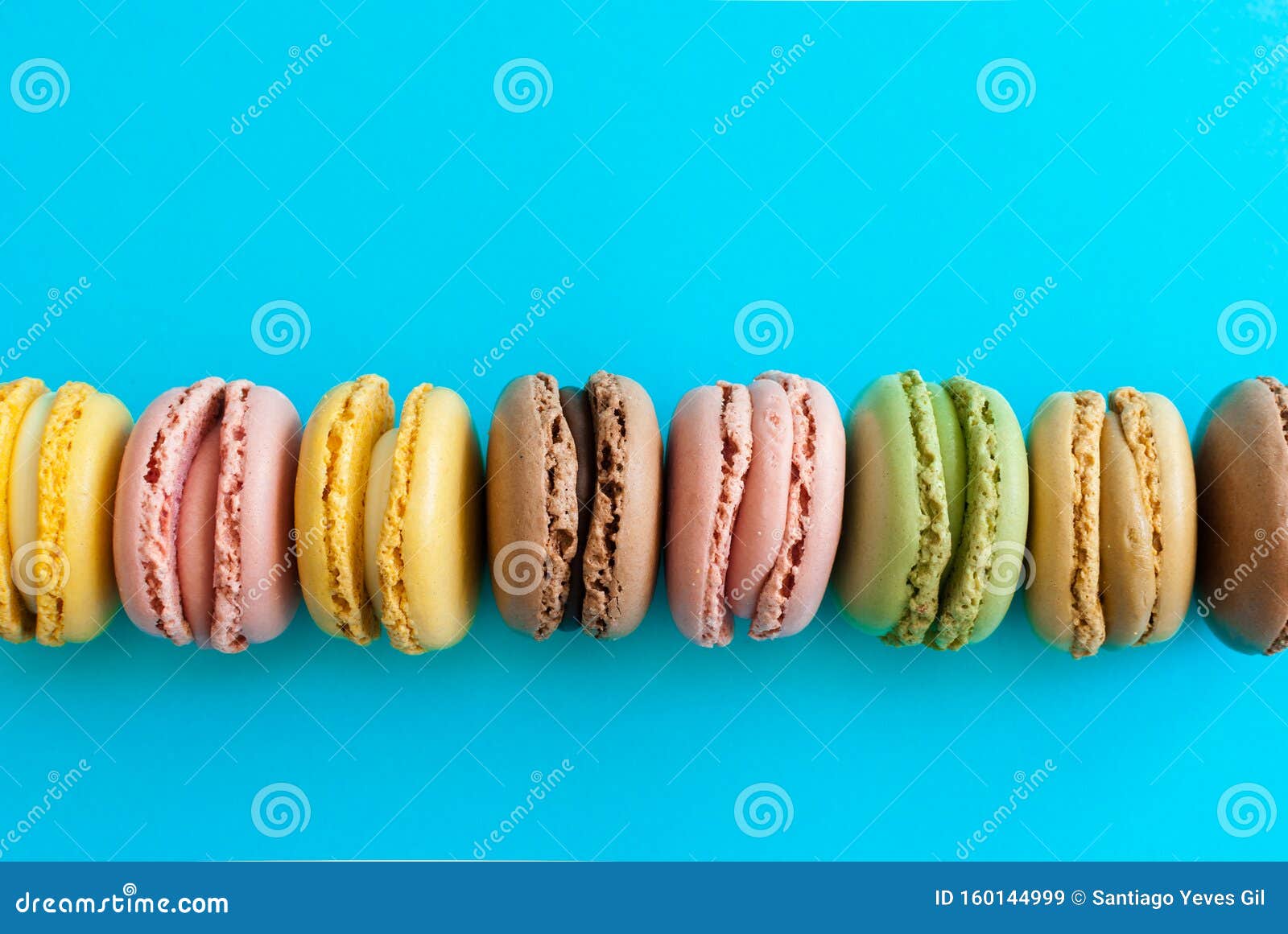 Top View of a Colorful French Macaron Dessert on a Blue Background ...