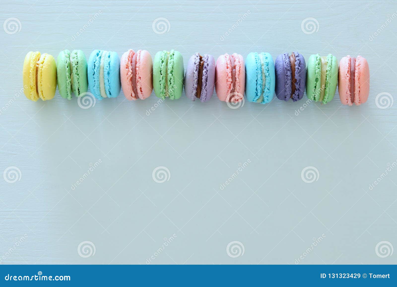 Top View of Colorful Macaron or Macaroon Over Pastel Blue Background ...