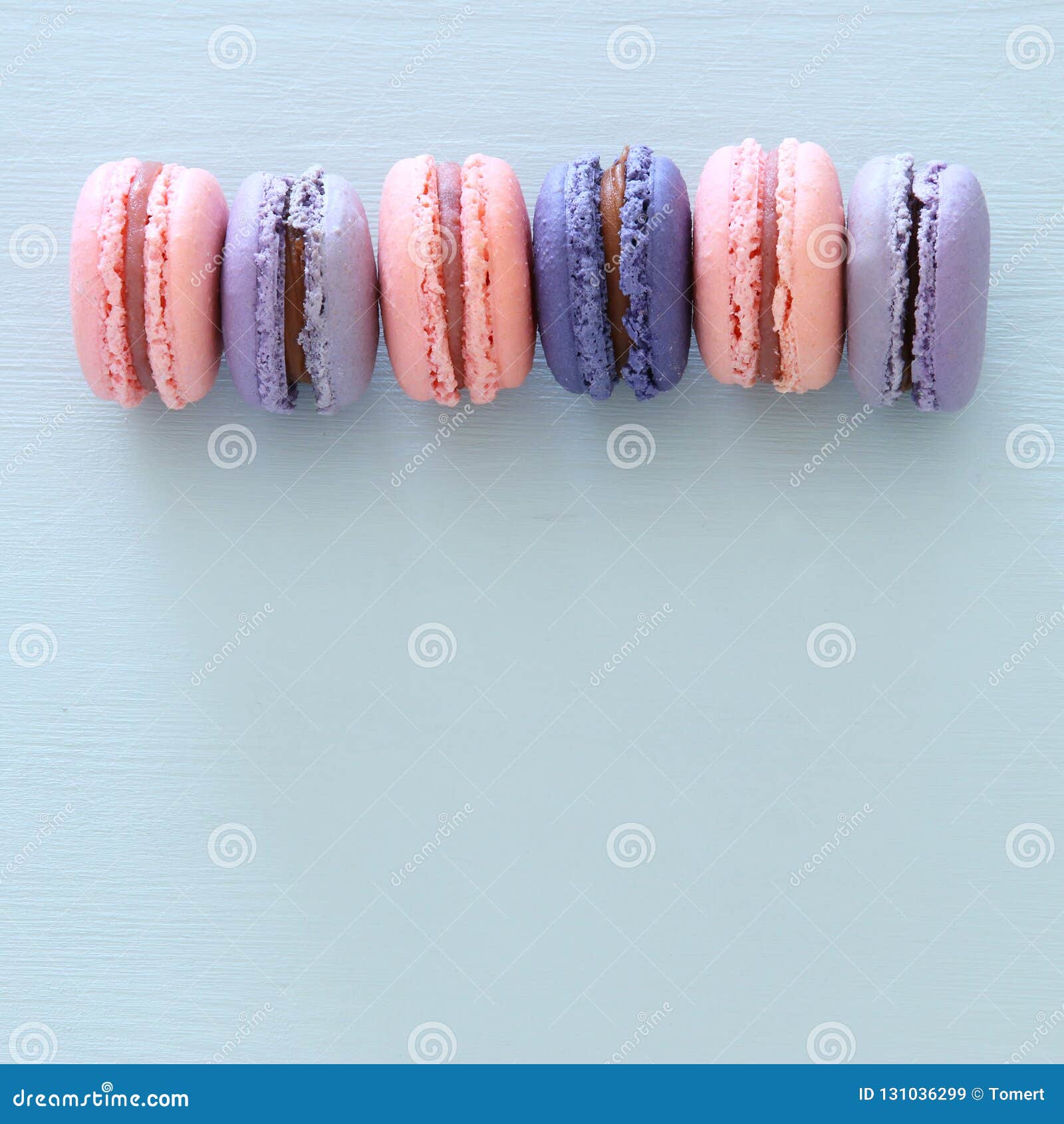 Top View of Colorful Macaron or Macaroon Over Pastel Blue Background ...