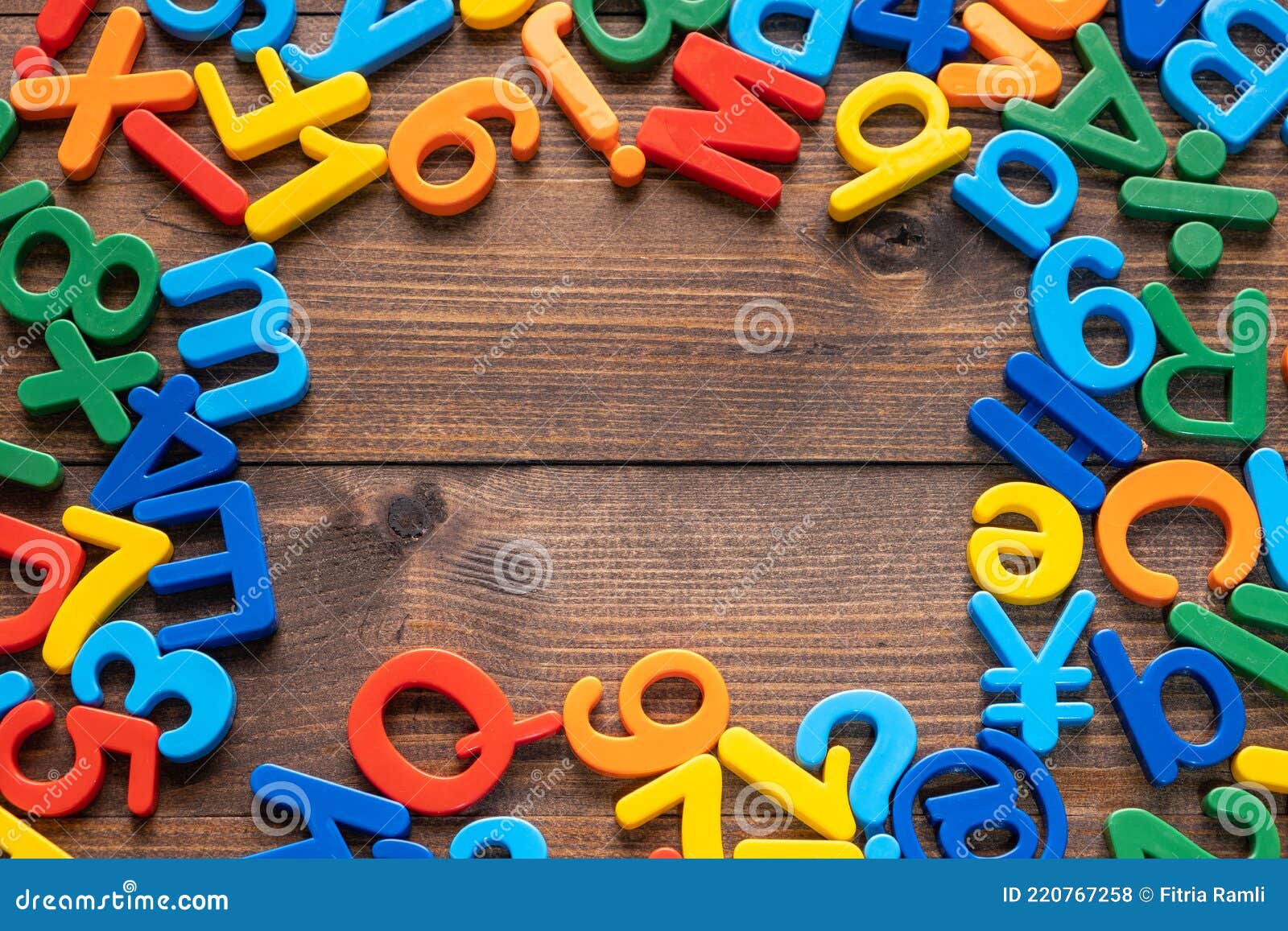 Colorful Plastic Letters And Numbers On Wooden Background Stock Photo