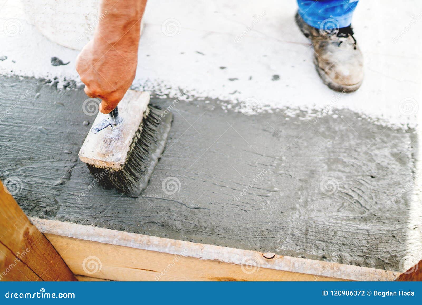 Top View of Construction Worker Using Paint Brush for Applying