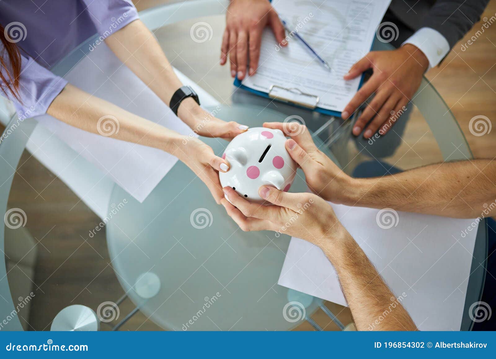 top view on couple dividing property, hold money box in hands