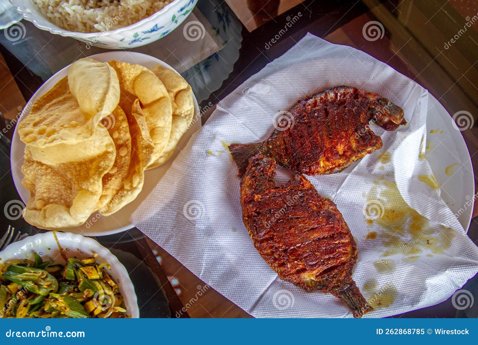 Top View of a Delicious Fried Fish and Vegetables on the Table Stock