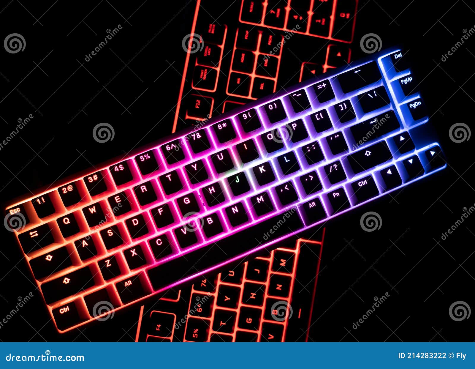 Top View of Two Illuminated RGB Keyboards in the Dark Stock Photo