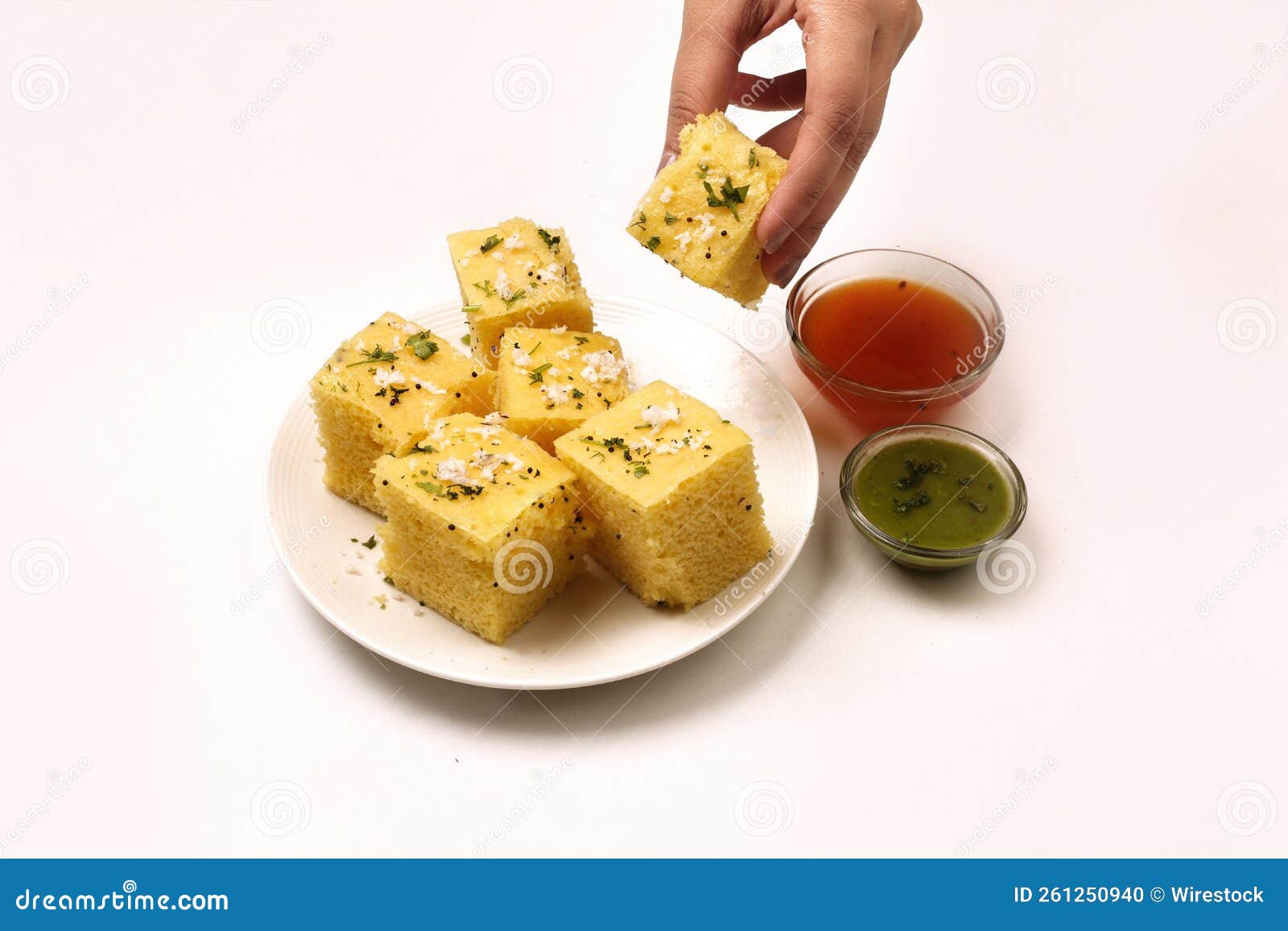 Top View of Dhokla Gujarati on a White Plate with Two Sauces on the