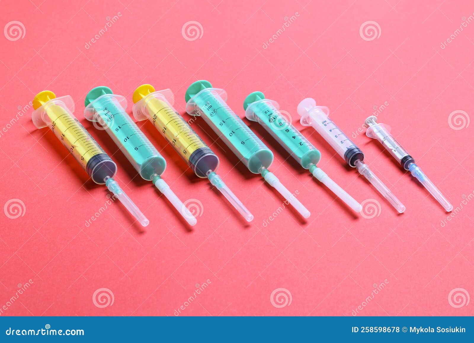 Top View of Different Syringes at Red Background. Medical Injection