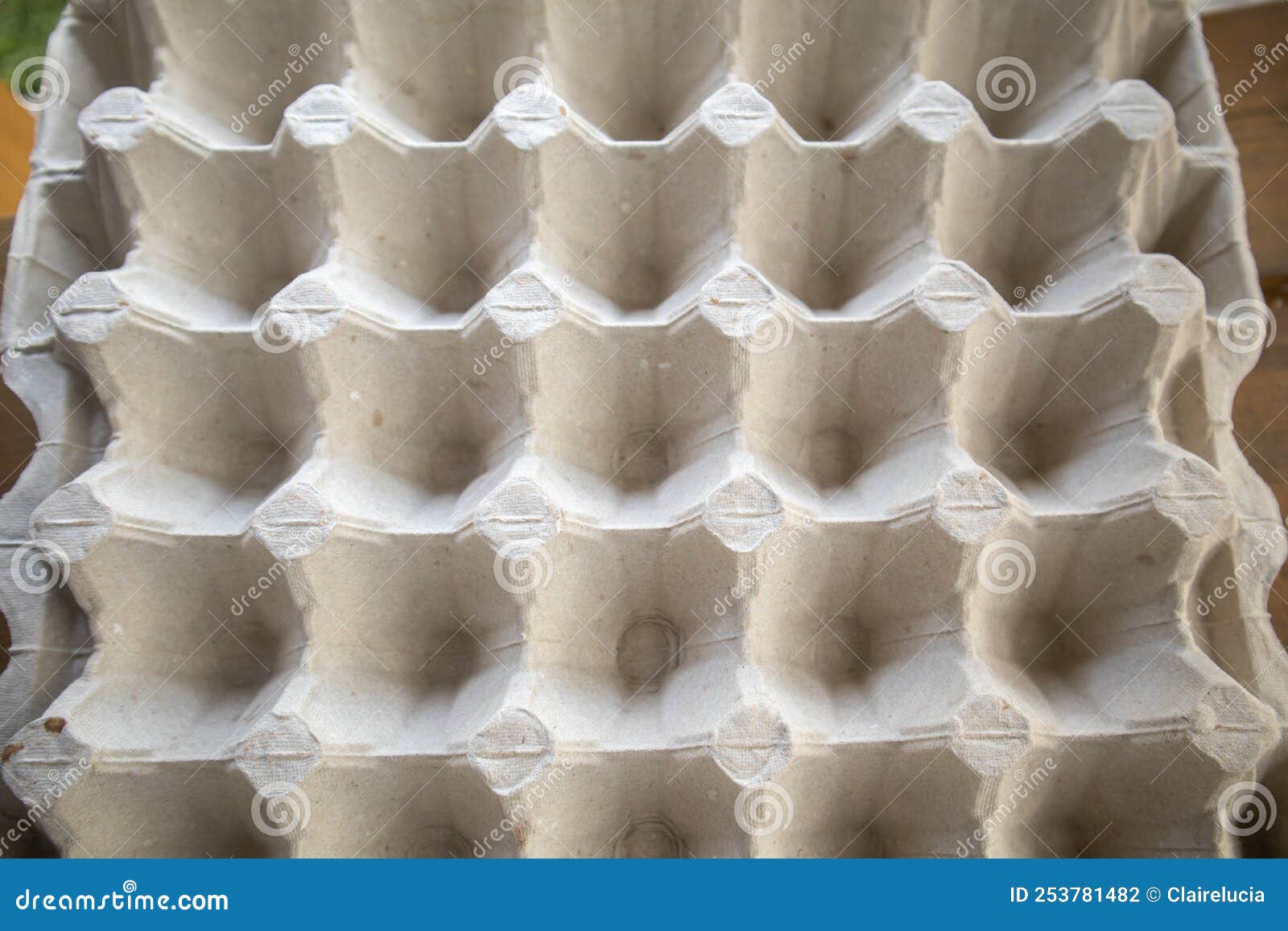 top view of an empty cardboard egg tray. background texture of a container made of biodegradable paper packaging with a