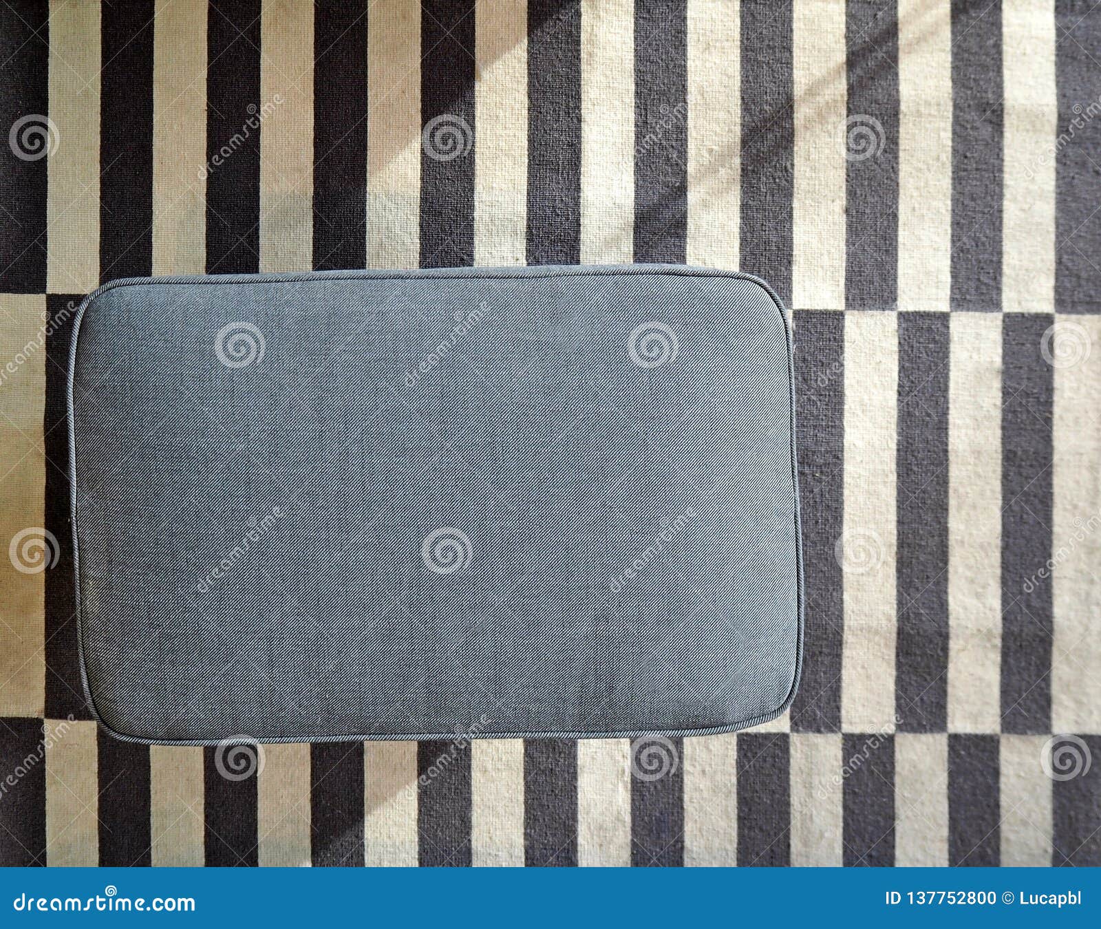 Top View Of Fabric Blue Rectangular Pouf On Blue And White Striped Carpet Stock Photo Image Of Clorh Relaxation 137752800