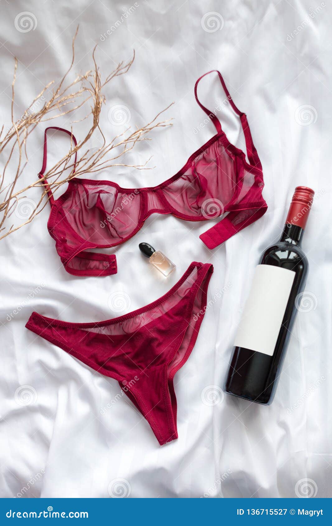 Top View Fashion Red Lace Lingerie with Bootle of Red Wine and