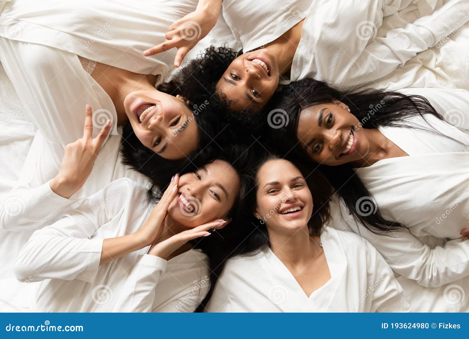 diverse women lying in bed feels happy after spa procedures