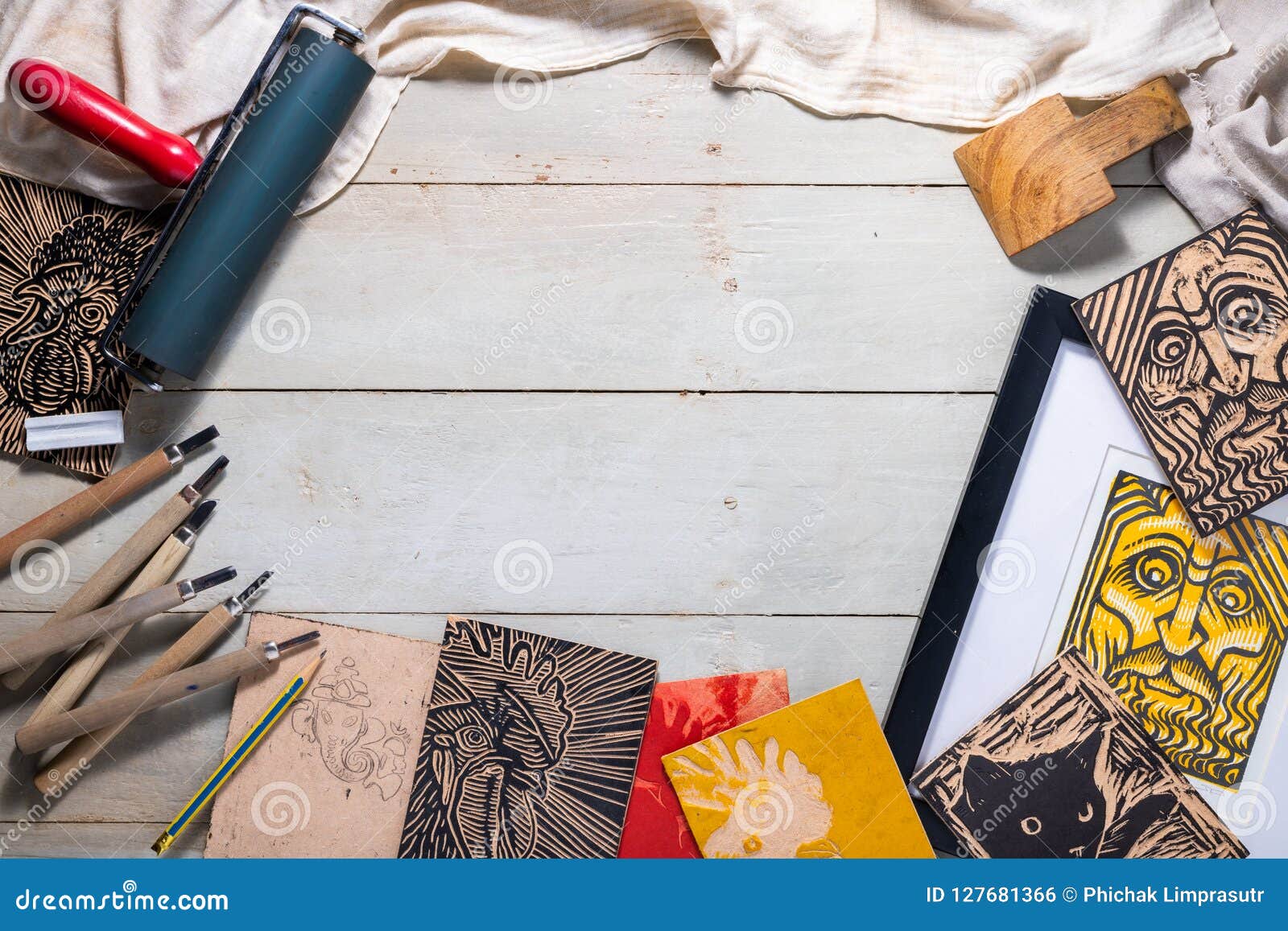 top view flat lay of printmaking tools for woodcut relief print