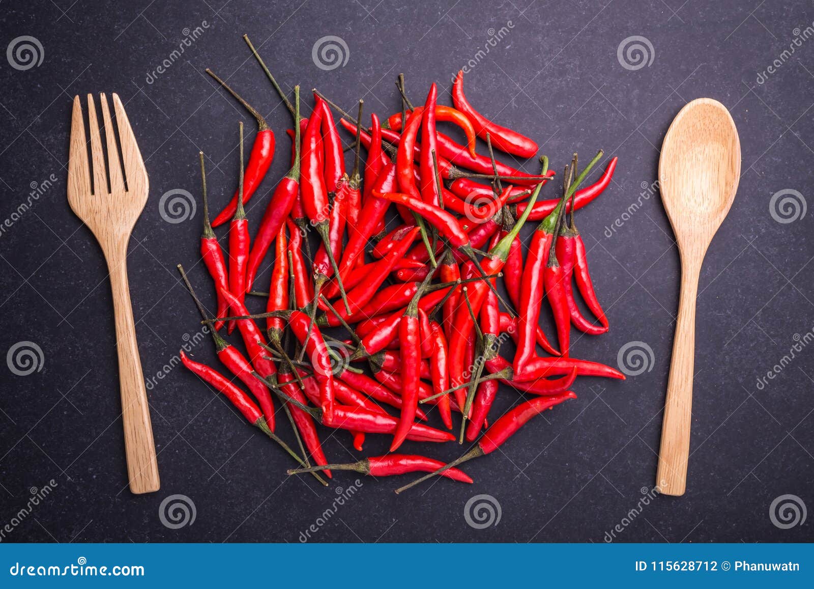 Top View Fresh Red Hot Chilli on Black Stone Board Stock Photo - Image
