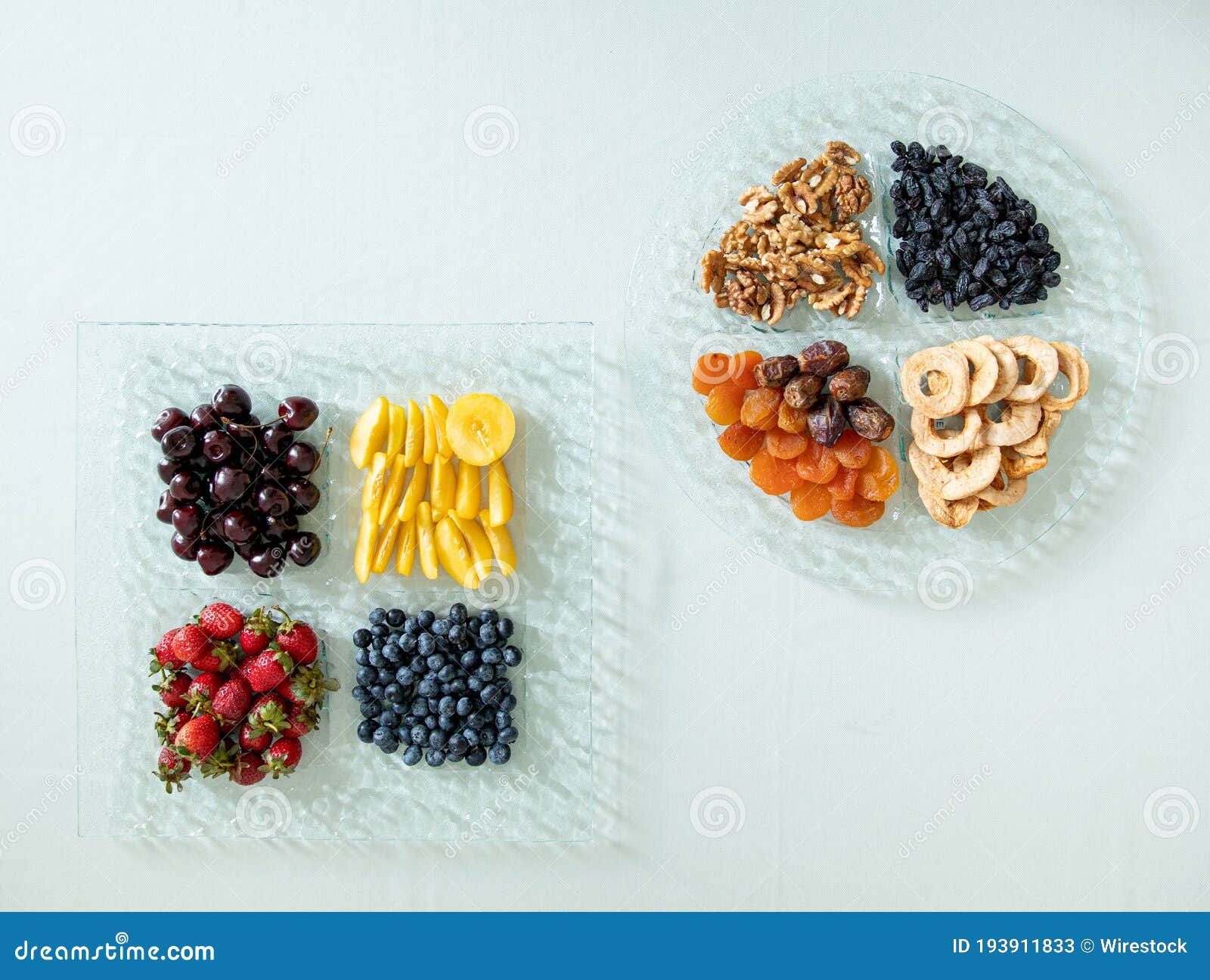 Top View of a Fruit Platter and a Nut Platter with Dried Fruits Stock