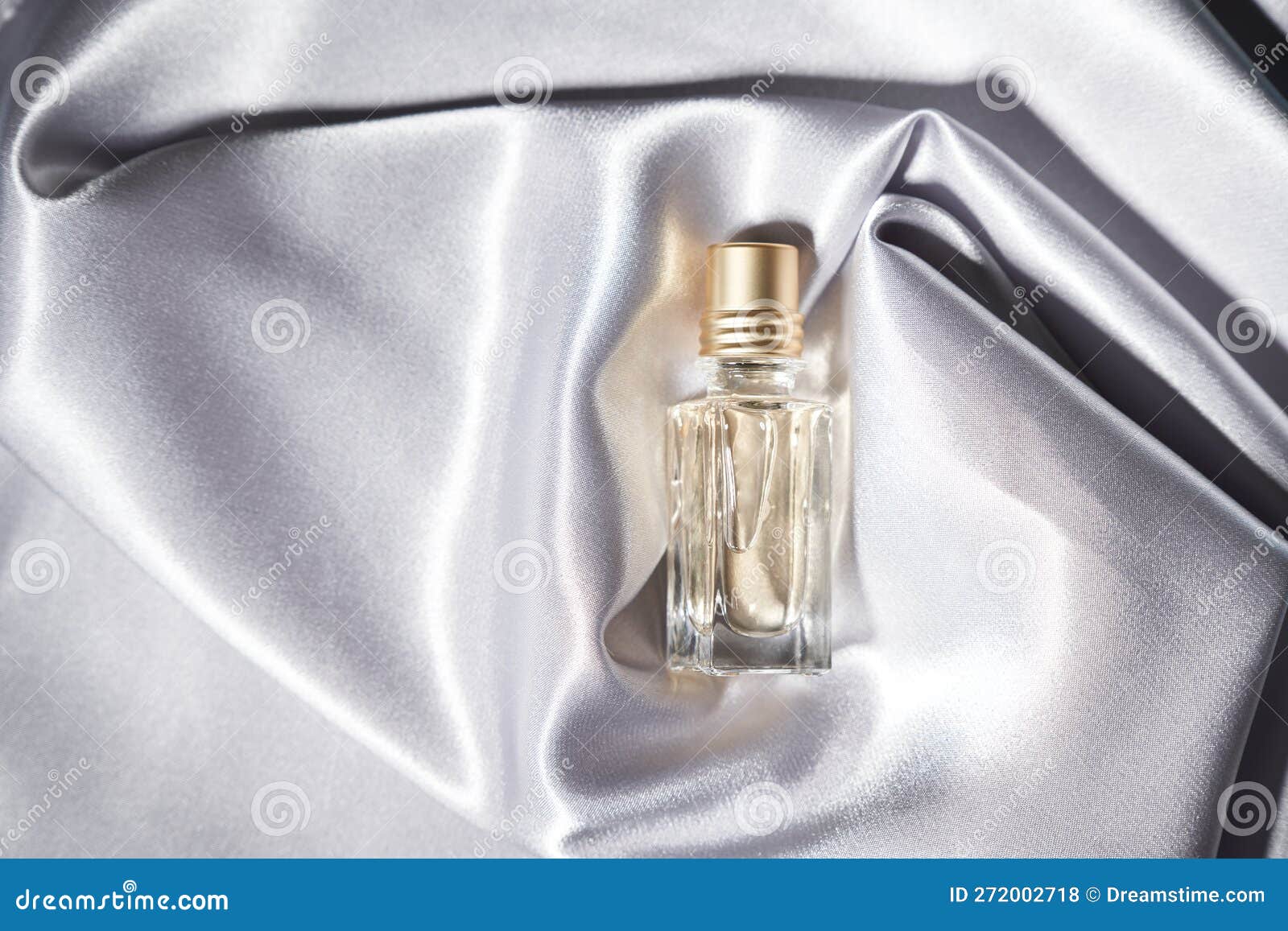 Top View of Glass Jar with Cologne in Soft Tissue Folds. Stock Photo ...