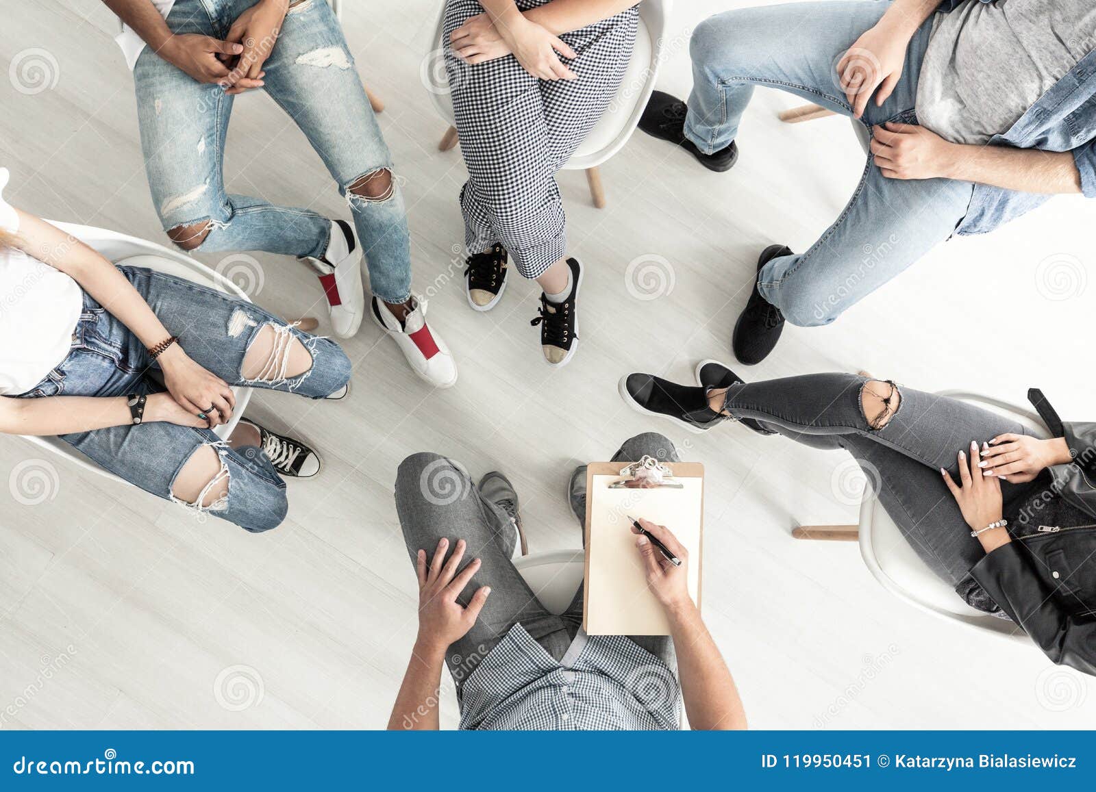 top view of a group therapy session for teenagers struggling wit