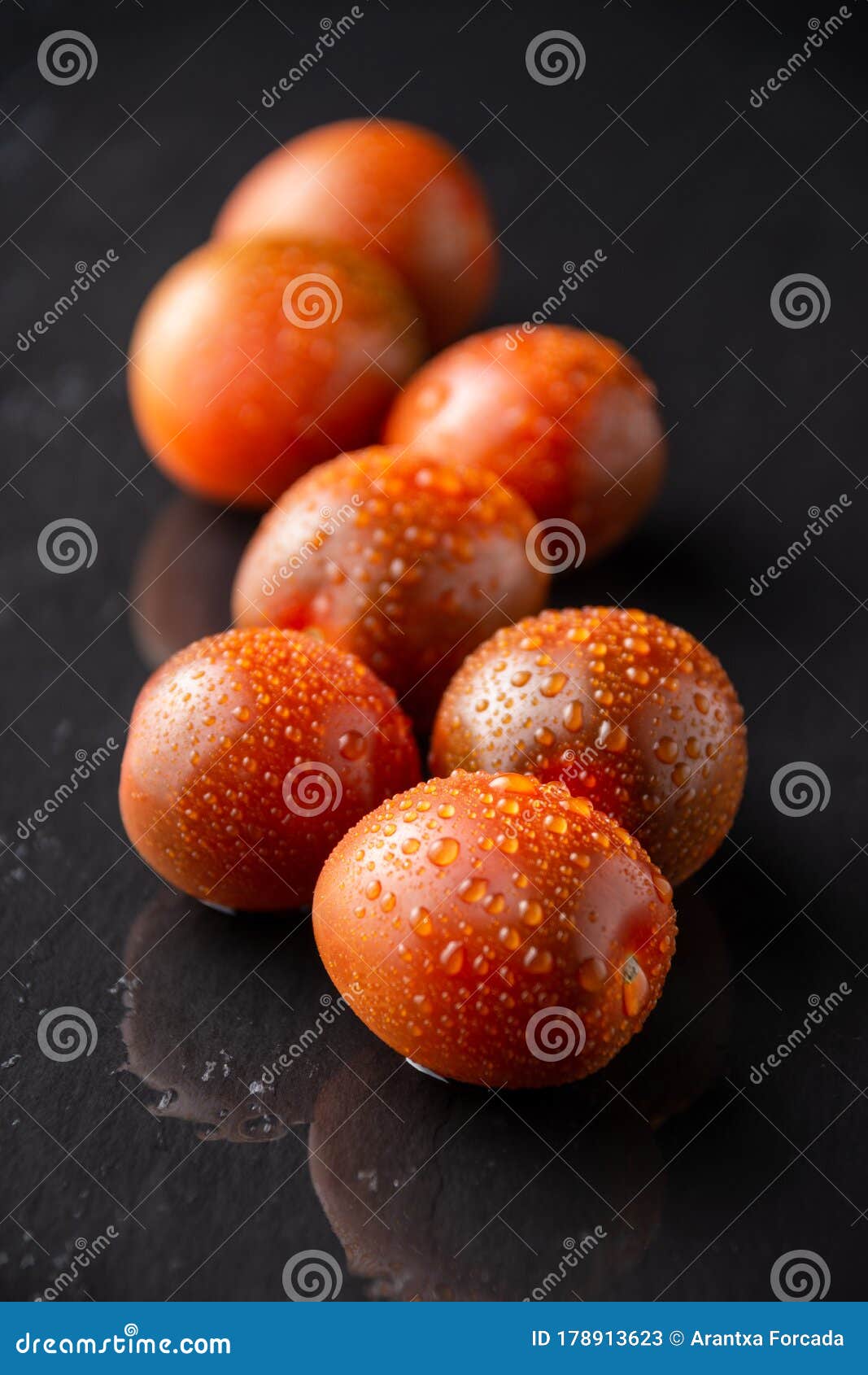 Top View of a Group of Wet Kumato Cherry Tomatoes, with Selective Focus