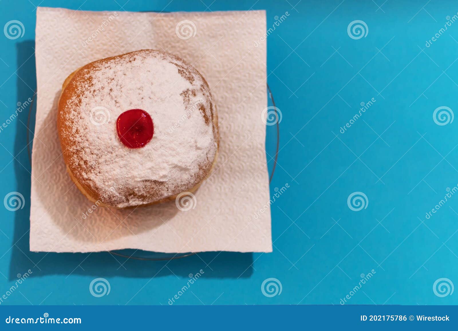 top view of a hanukkah mocks sufganiyah doughnut - traditional jewish s of sweet doughnut