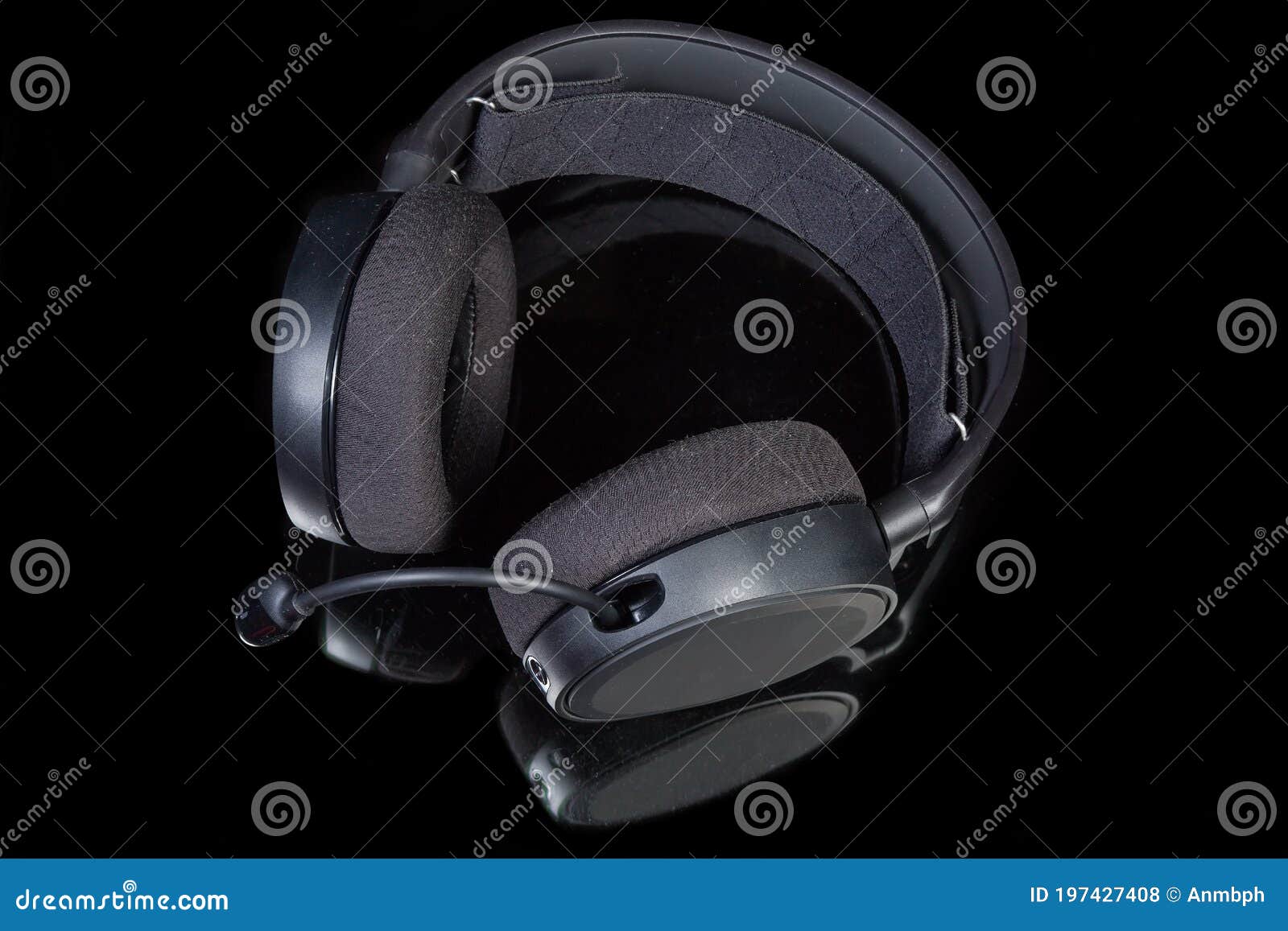 top view of headset with circumaural earpads on dark surface