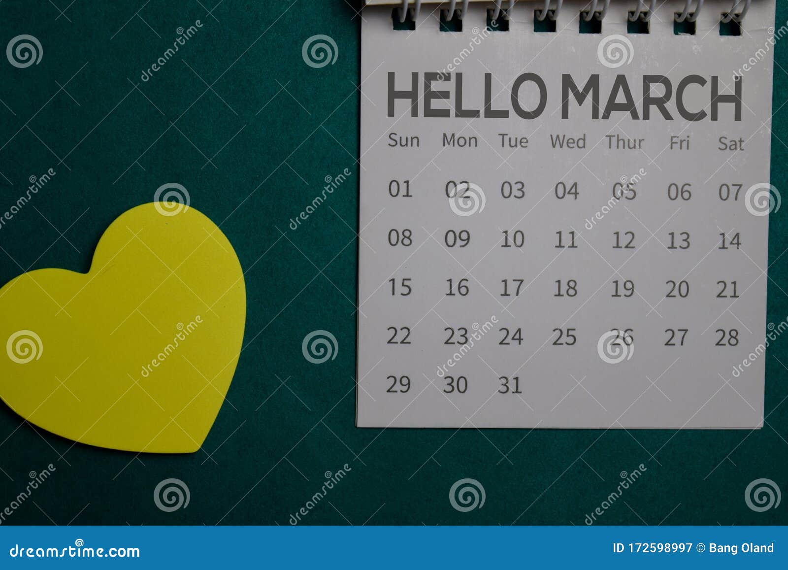 Top View Hello March Text On A Calendar Isolated On Office Desk