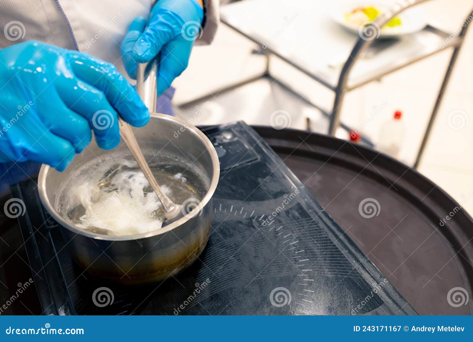 Top View of a Ladle of Boiling Water, the Cook Stirs a Poached Egg with