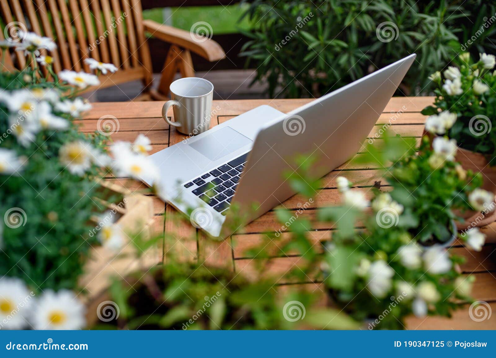Top View of Laptop on Table on Balcony in Summer, Outdoors Office