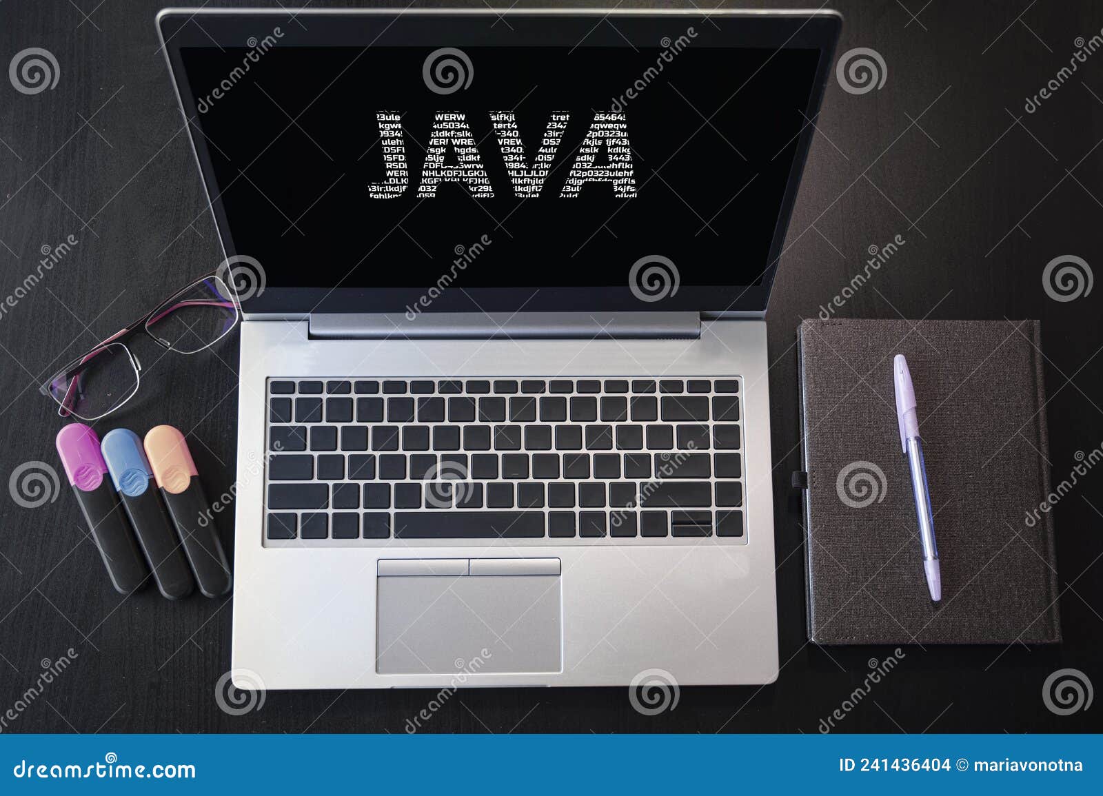 Top View of Laptop with Text Java. JAVA Inscription on Laptop Screen and Keyboard Editorial