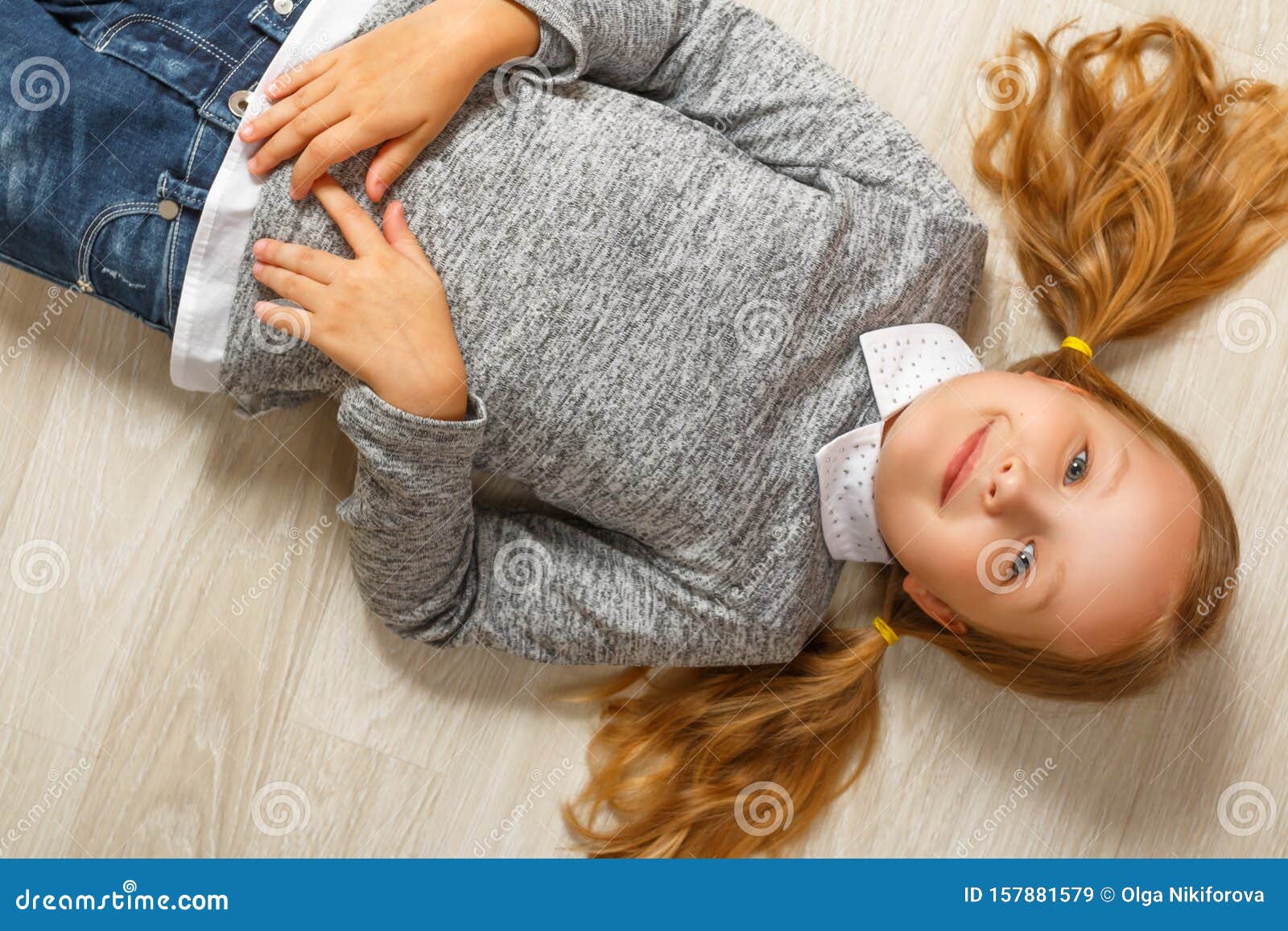 Top View of a Little Girl Lying on the Floor Stock Image Image of house, jeans 157881579