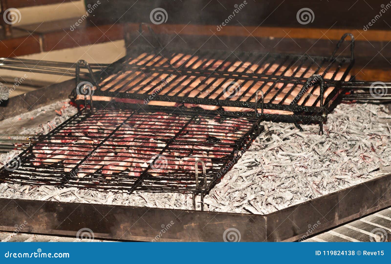 Steak And Duck Breasts Grilled Over Open Fire Pit In Wine Cellar
