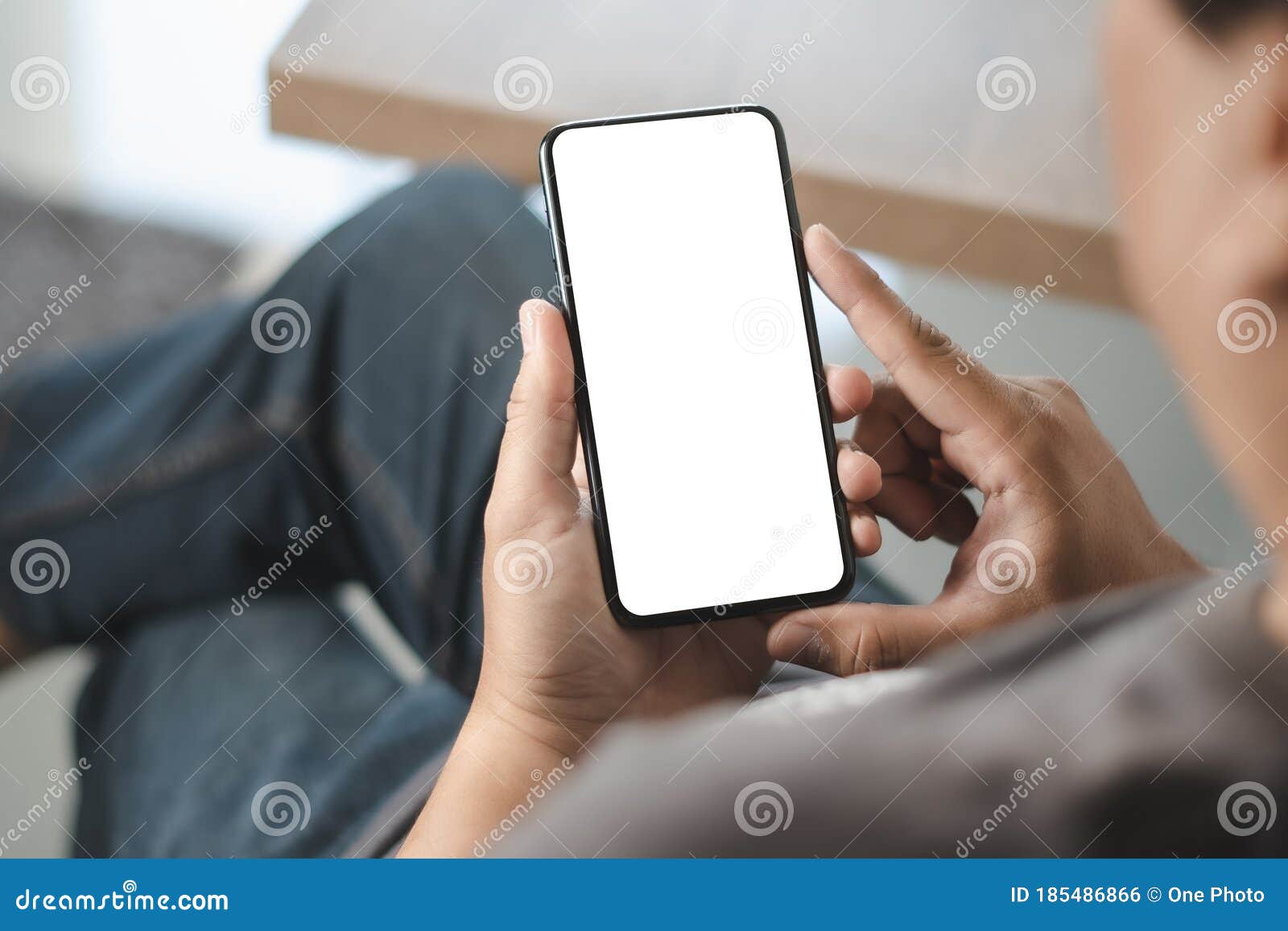 top view mockup image hand using a smartphone man holding cell phone with blank