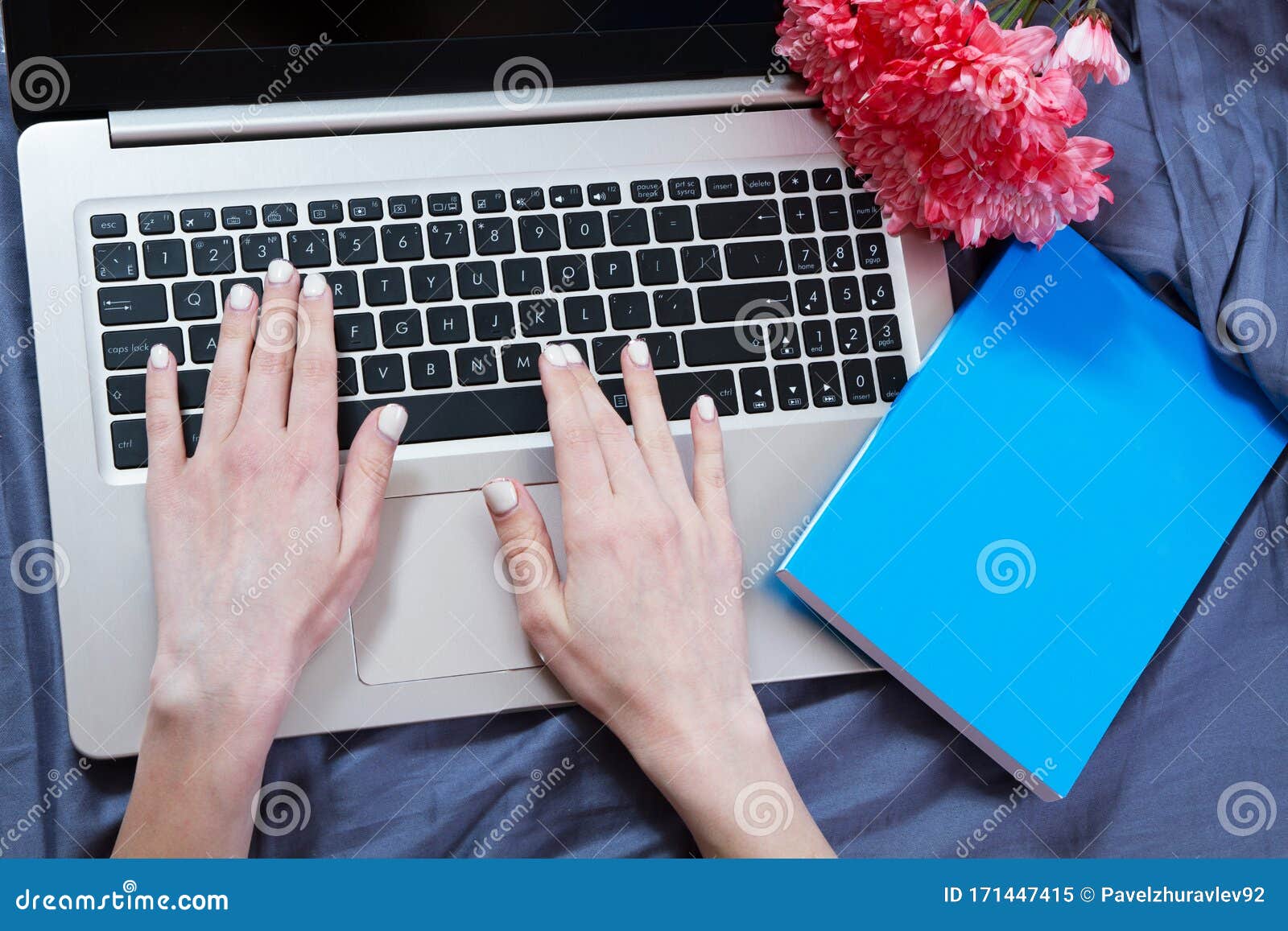 Top View Mockup Image of a Woman Sitting on a Bed , Using and Typing on