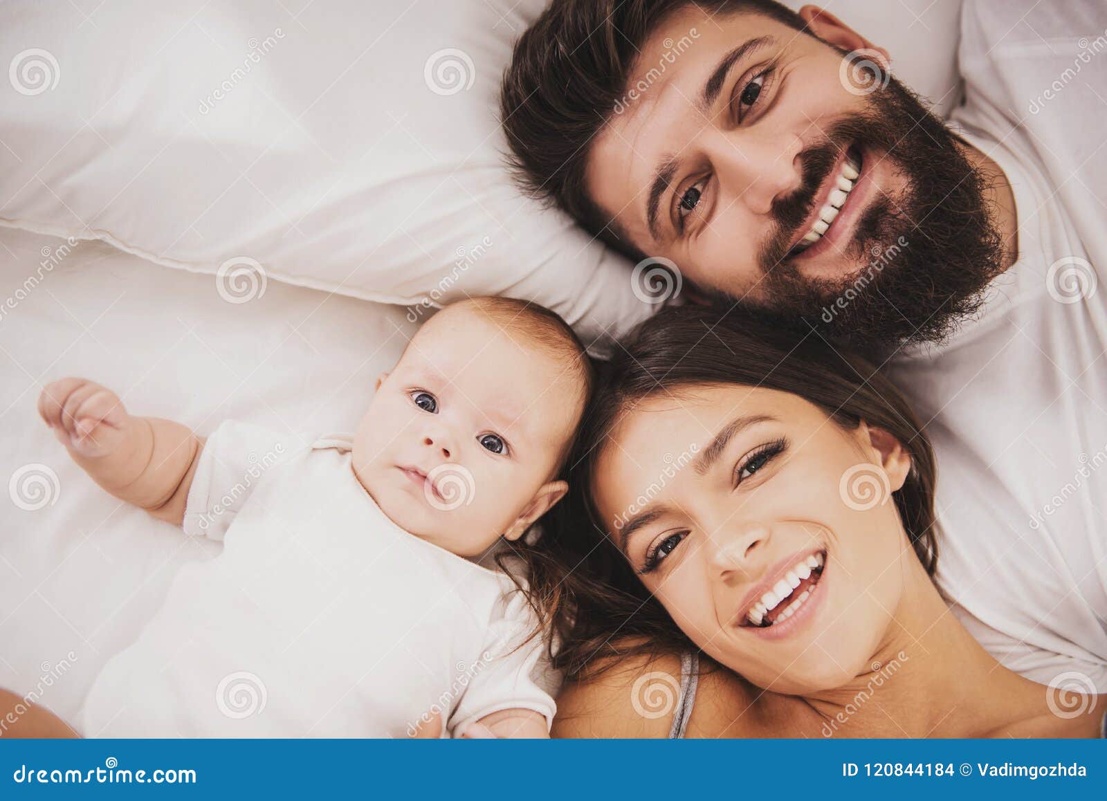 Top View. Mother and Father with Baby in Bed Stock Photo - Image ...