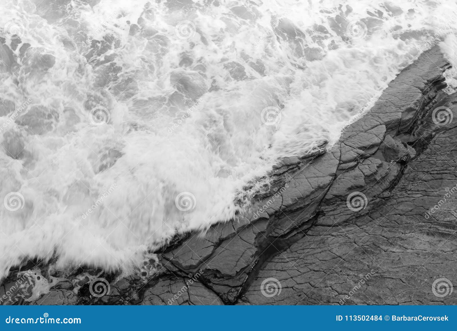 Top View on Moving Sea Water Against Rocks with Waves and Foam ...