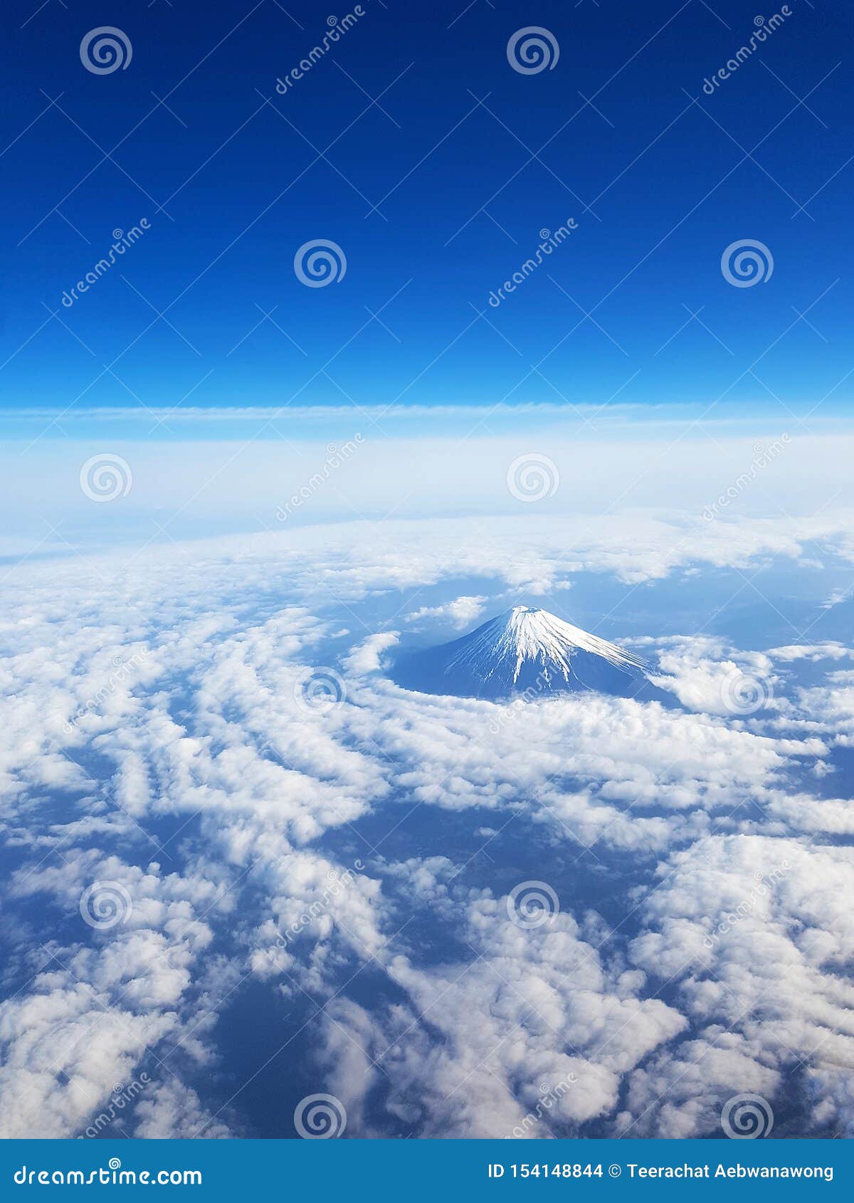 Top View - Mt Fuji from Sky View on Window Seat of Plane. Blue Sky and ...