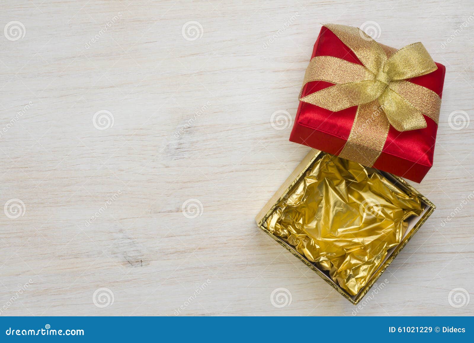 Top View of Open Gift Box on Wooden Texture Background Stock Image