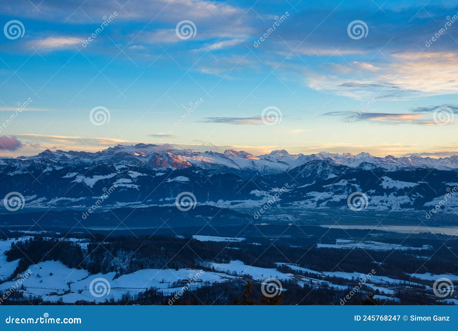 top view from orn bachtel range located at zurich oberland during winter sunset time. panorama view over lake of zurich