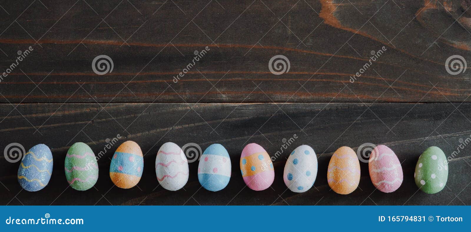 Top View and Panorama of Easter Eggs on Rustic Wood Background with