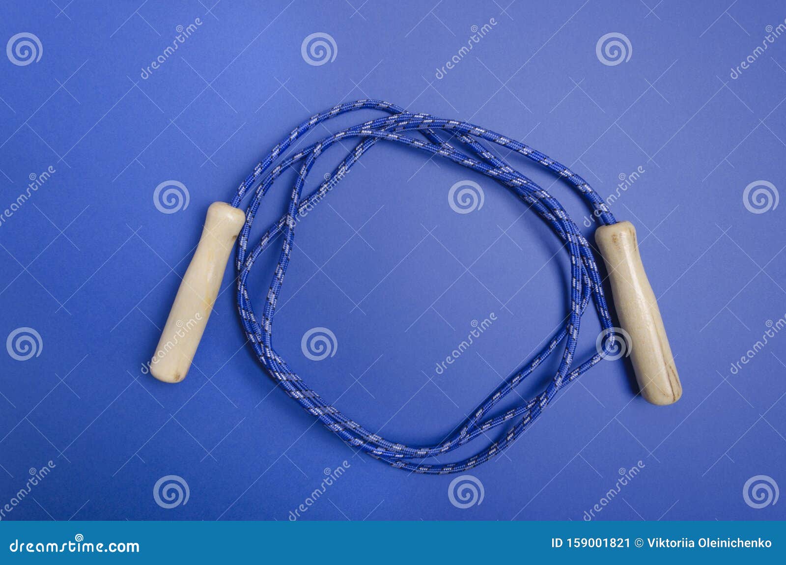 Skipping Rope on the Dark Blue Background.Empty Space for Design Stock