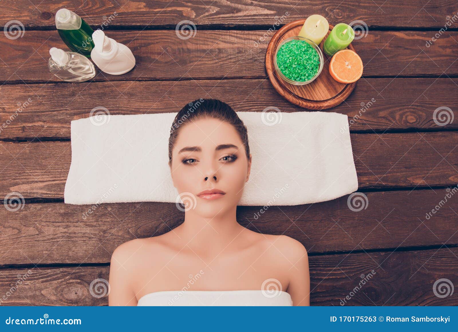 Top View Photo Of Attractive Young Girl Relaxing In Spa Salon With Spa Cosmetics Stock Image