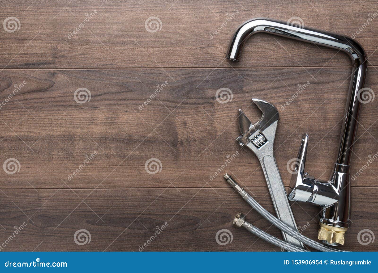 top view photo of plumbing tools over wooden background with copy space.