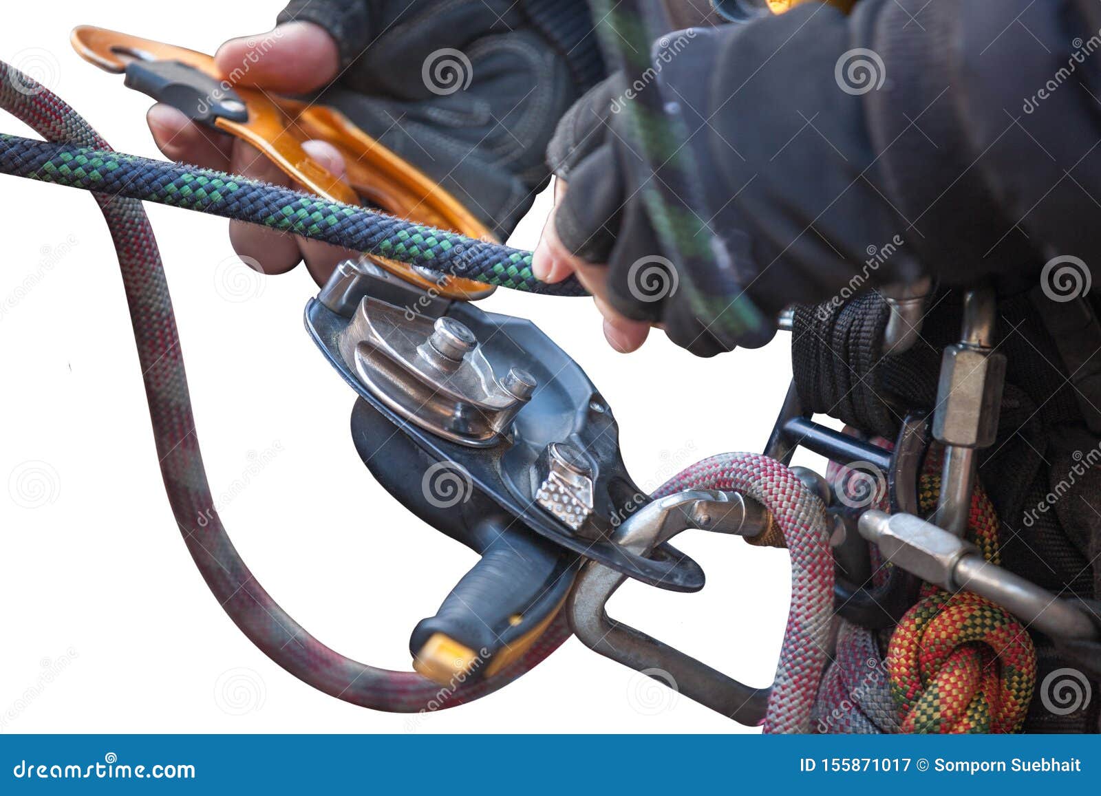 industrial rope access worker hand connecting nylon low stretch rope into descender which its attached with harness loop