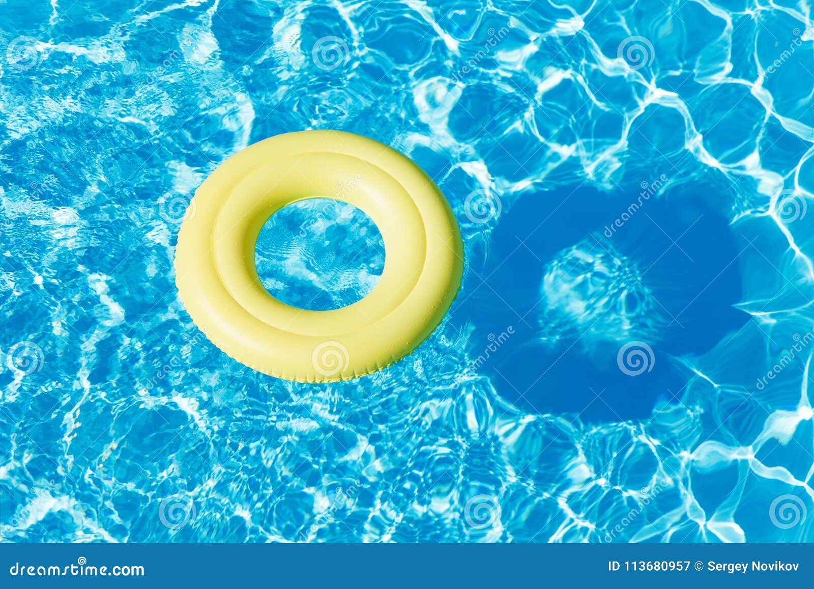 Yellow Rubber Ring Floating on the Water Surface Stock Image - Image of ...