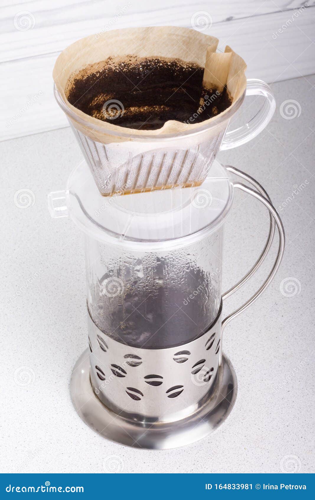 Top View the Process of Brewing Ground Coffee in a Funnel V60 and