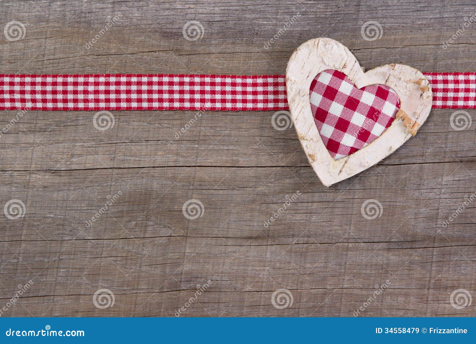 top view of red checked heart decoration on wooden background -