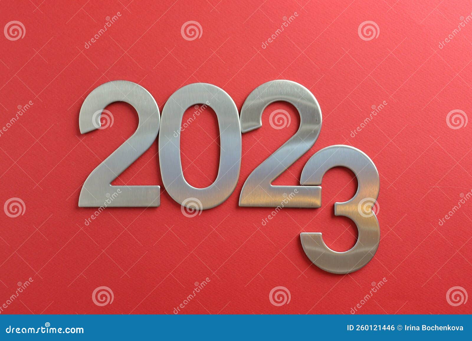 top view silver numerals with the new year on a red monochrome background